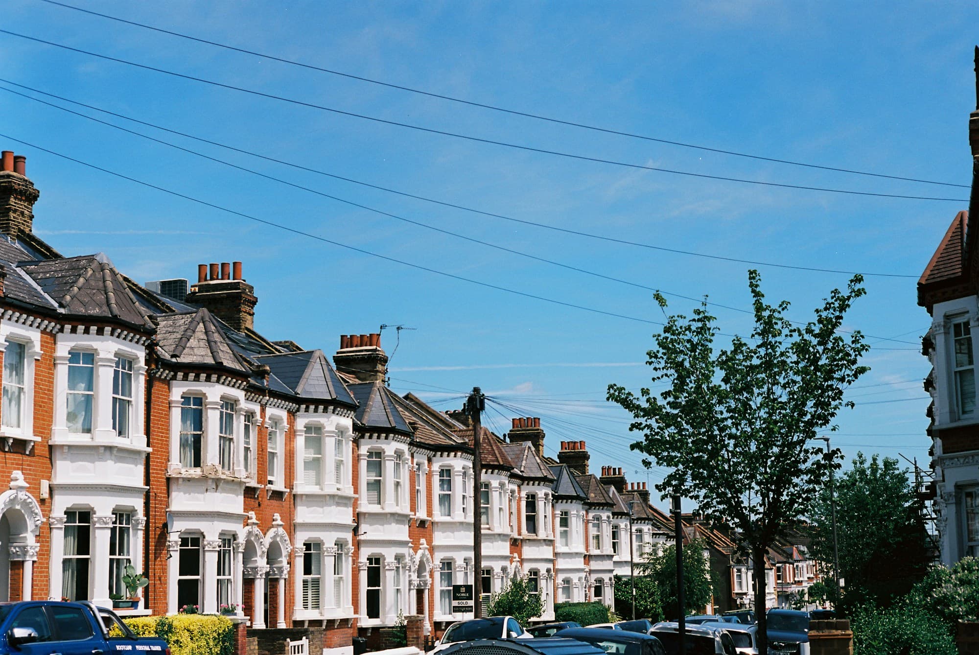 Row of traditional English terraced houses on a residential street